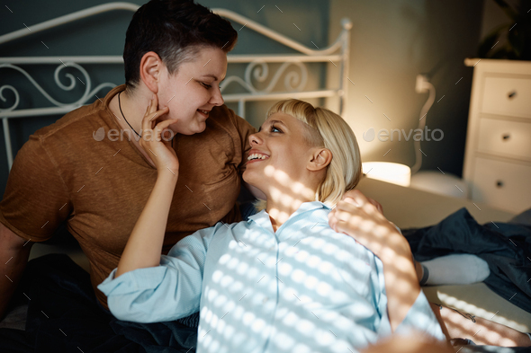 Happy Lesbian Couple Enjoying In Intimate Moments In Their Bedroom